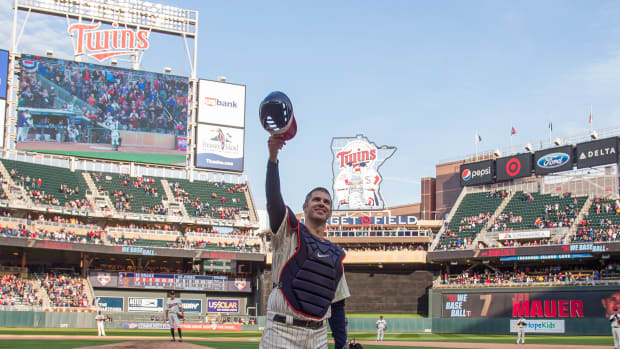 Sep 30, 2018; Minneapolis, MN, USA; Minnesota Twins catcher Joe Mauer (7) salutes the crowd in the ninth inning against Chicago White Sox at Target Field.