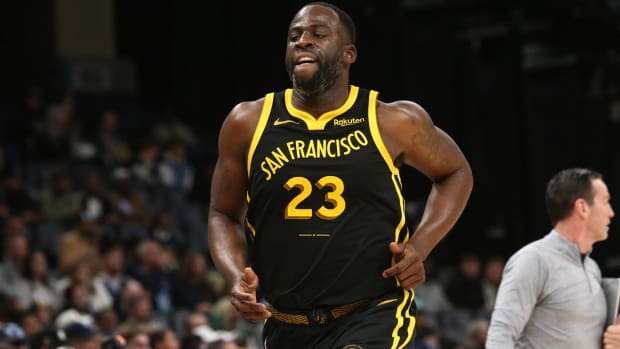 Draymond Green jogs down the court during a game.
