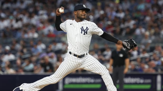 Jul 31, 2023; Bronx, New York, USA; New York Yankees starting pitcher Domingo German (0) delivers a pitch during the seventh inning against the Tampa Bay Rays at Yankee Stadium. Mandatory Credit: Vincent Carchietta-USA TODAY Sports