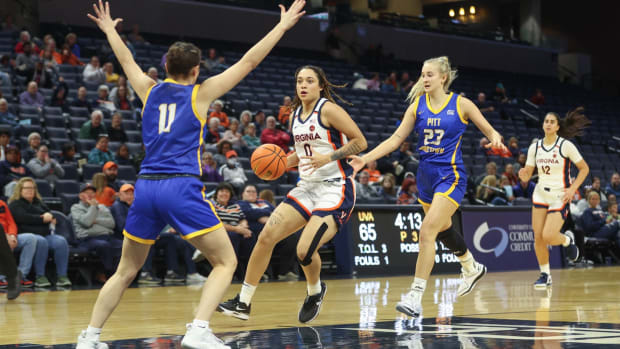 Olivia McGhee drives the ball during the Virginia women's basketball exhibition game against Pitt Johnstown at John Paul Jones Arena.