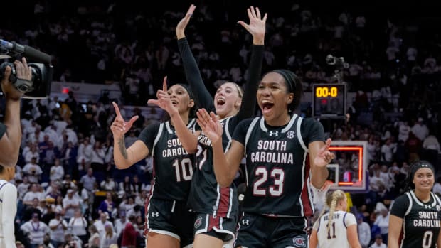 South Carolina Gamecocks center Kamilla Cardoso (10), forward Chloe Kitts (21), and guard Bree Hall (23) celebrate their victory against the LSU Tigers.