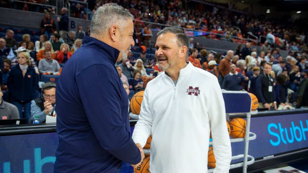 Auburn Tigers head coach Bruce Pearl and Mississippi State Bulldogs head coach Chris Jans shake hands before the game as Auburn Tigers take on Mississippi State Bulldogs at Neville Arena in Auburn, Ala., on Saturday, Jan. 14, 2023.