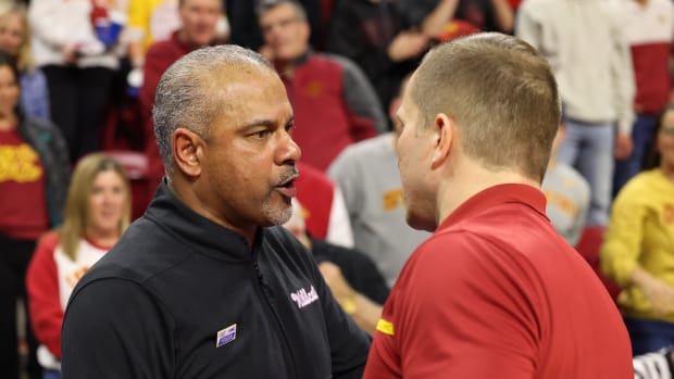 Kansas State coach Jerome Tang and Iowa State coach T.J. Otzelberger talk after their game. Tang said he told Otzelberger about Kansas State's accusations during this exchange.