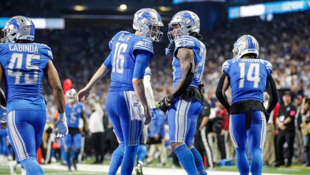 Detroit Lions running back Jahmyr Gibbs (26) celebrates a touchdown against Tampa Bay Buccaneers with quarterback Jared Goff (16) during the second half of the NFC divisional round at Ford Field in Detroit on Sunday, Jan. 21, 2024.  