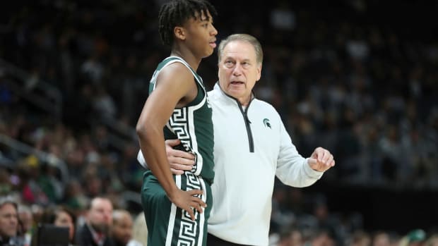 Michigan State coach Tom Izzo talks with guard Jeremy Fears Jr. during MSU's 88-64 win over Baylor on Saturday, Dec. 16, 2023, at Little Caesars Arena.