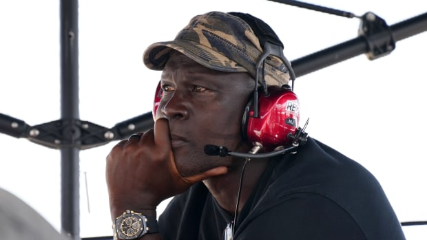Team co-owner Michael Jordan sits atop of the pitbox during the 4EVER 400 presented by Mobil 1 at Homestead-Miami Speedway.