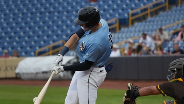 Lake County Captains outfielder Chase DeLauter (36) hits a ball against the Fort Wayne TinCaps.
