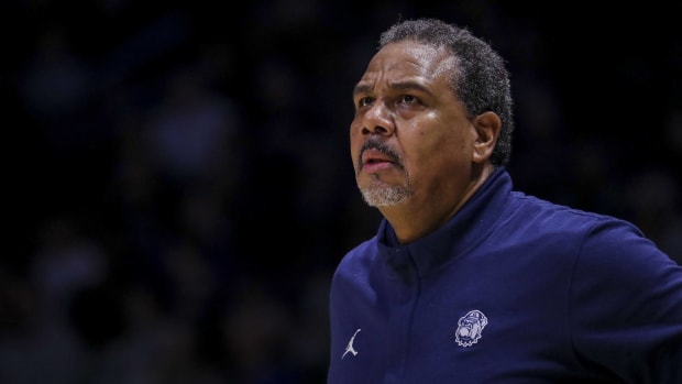 Georgetown head coach Ed Cooley looks on while coaching in a game.