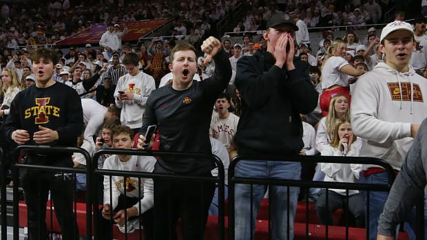 Iowa State fans react as the Kansas Jayhawks men's basketball team enter the court before the game in the Big-12 conference showdown of an NCAA college basketball at Hilton Coliseum on Saturday, Jan. 27, 2024, in Ames, Iowa.  