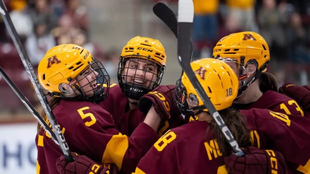 Gophers players celebrate their win over Minnesota State