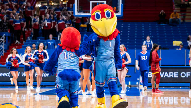 Kansas Jayhawks mascots Big Jay and Baby Jay meet at halfcourt during pregame warmups for the game between the Kansas Jayhawks and Iowa State Cyclones in Allen Fieldhouse on January 24th, 2024.