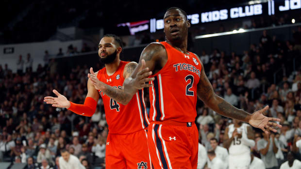 Jan 27, 2024; Starkville, Mississippi, USA; Auburn Tigers forward/center Johni Broome (4) and forward Jaylin Williams (2) react after a foul call during the second half against the Mississippi State Bulldogs at Humphrey Coliseum. Mandatory Credit: Petre Thomas-USA TODAY Sports  
