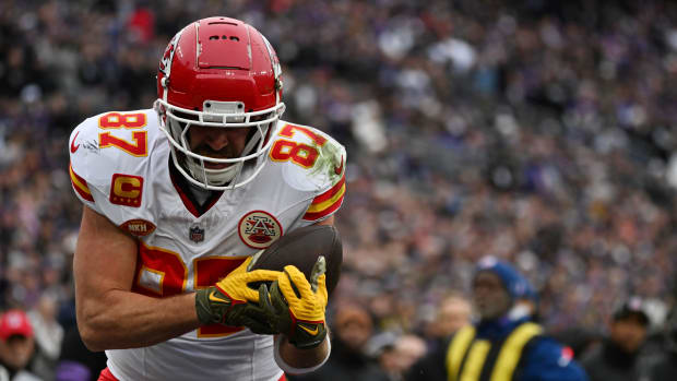 Jan 28, 2024; Baltimore, Maryland, USA; Kansas City Chiefs tight end Travis Kelce (87) catches a touchdown pass in front of Baltimore Ravens safety Kyle Hamilton (not pictured) defends in the AFC Championship football game at M&T Bank Stadium. Mandatory Credit: Tommy Gilligan-USA TODAY Sports  