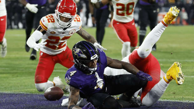Ex-Husky Trent McDuffie pounces on a Ravens fumble in the end zone.