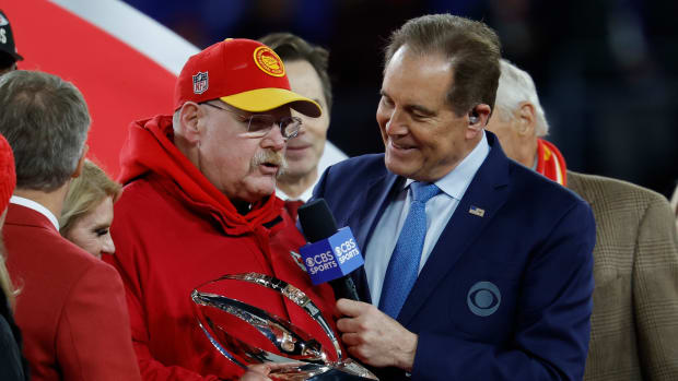 Jan 28, 2024; Baltimore, Maryland, USA; Kansas City Chiefs head coach Andy Ried (L) talks with CBS broadcaster Jim Nantz (R) during the trophy presentation after the Chiefs' game against the Baltimore Ravens in the AFC Championship football game at M&T Bank Stadium. Mandatory Credit: Geoff Burke-USA TODAY Sports  