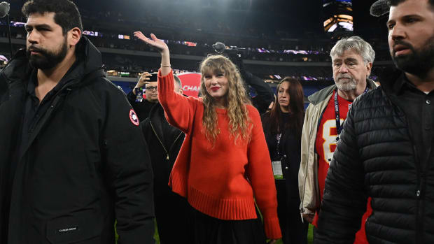 Taylor Swift waves as she walks off the field after the AFC championship game between the Kansas City Chiefs and Baltimore Ravens on Jan. 28, 2024.