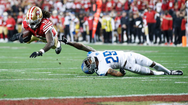 49ers wide receiver Brandon Aiyuk catches the ball over Lions cornerback Kindle Vildor in the third quarter of the NFC championship game at Levi's Stadium in Santa Clara, California, on Sunday, Jan. 28, 2024.  
