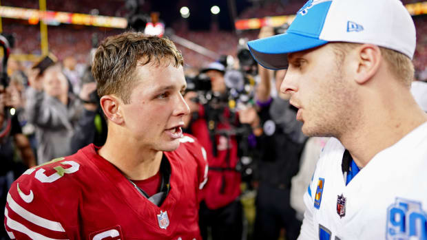 Jared Goff, right, talks with Brock Purdy after the NFL championship game