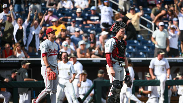 Jun 17, 2023; Omaha, NE, USA; Stanford Cardinal catcher Malcolm Moore (10) and pitcher Ryan Bruno (34) return to the field after the Wake Forest Demon Deacons score the go ahead run in the eighth inning at Charles Schwab Field Omaha. Mandatory Credit: Steven Branscombe-USA TODAY Sports