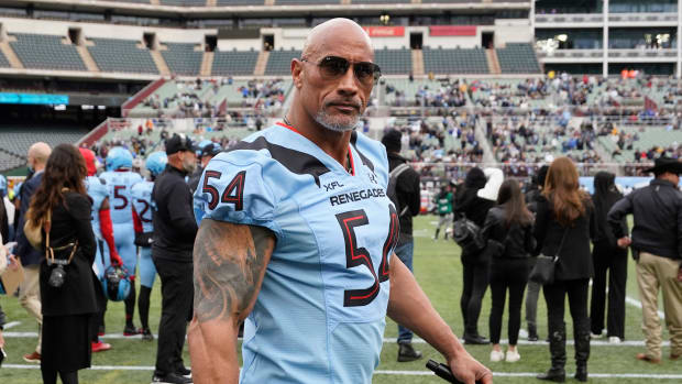 Feb 18, 2023; Arlington, TX, USA; XFL owner Dwayne Johnson on the sidelines during the first half between the Vegas Vipers and the Arlington Renegades at Choctaw Stadium. Mandatory Credit: Raymond Carlin III-USA TODAY Sports  