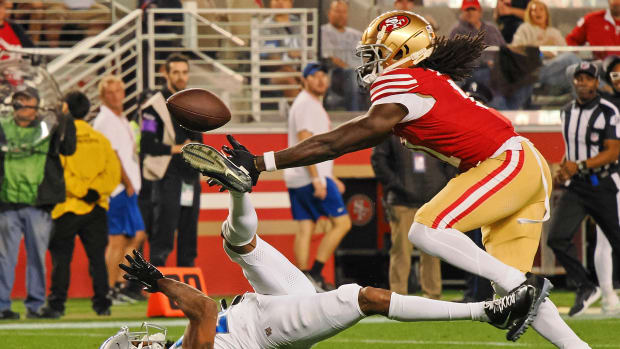 Jan 28, 2024; Santa Clara, California, USA; San Francisco 49ers wide receiver Brandon Aiyuk (11) catches a ball that bounced off the face mask of Detroit Lions cornerback Kindle Vildor (29) during the second half of the NFC Championship football game at Levi's Stadium. Mandatory Credit: Kelley L Cox-USA TODAY Sports  