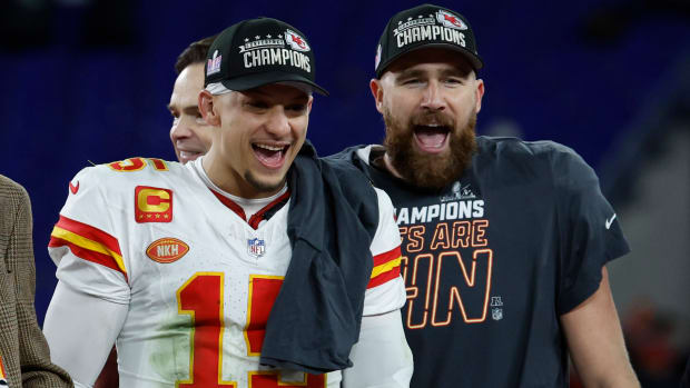 Chiefs quarterback Patrick Mahomes and tight end Travis Kelce celebrate after beating the Ravens in the AFC championship.