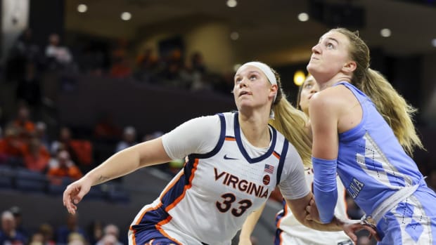 Sam Brunelle battles for a rebound during the Virginia women's basketball game against North Carolina at John Paul Jones Arena.