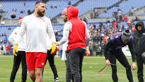 Travis Kelce, Patrick Mahomes, and Justin Tucker converse ahead of the AFC championship between the Kansas City Chiefs and Baltimore Ravens.