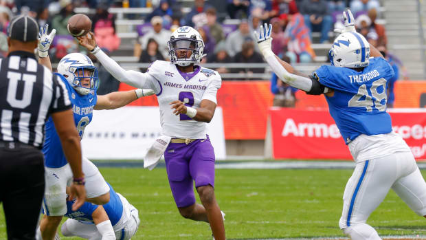 Dec 23, 2023; Fort Worth, TX, USA; James Madison Dukes quarterback Jordan McCloud (2) throws while under pressure by the Air Force Falcons during the first quarter at Amon G. Carter Stadium. Mandatory Credit: Andrew Dieb-USA TODAY Sports