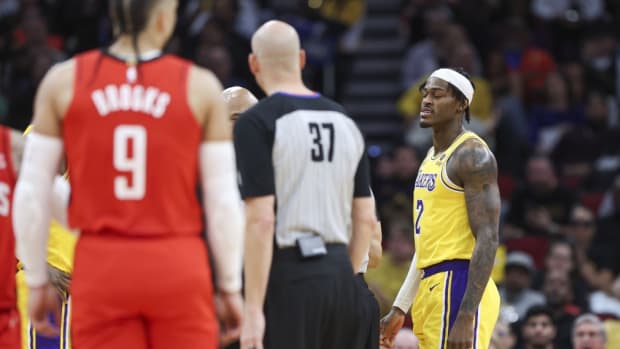 Jan 29, 2024; Houston, Texas, USA; Los Angeles Lakers forward Jarred Vanderbilt (2) reacts after an exchange with Houston Rockets forward Dillon Brooks (9) during the second quarter at Toyota Center.