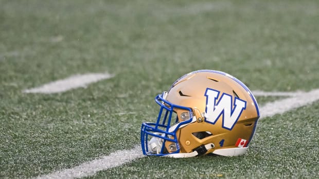 Jul 1, 2023; Montreal, Quebec, CAN; Winnipeg Blue Bombers helmet laying on the field during warm-up before the game against the Montreal Alouettes at Percival Molson Memorial Stadium. Mandatory Credit: David Kirouac-USA TODAY Sports  