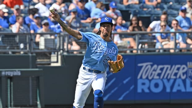 Sep 5, 2021; Kansas City, Missouri, USA; Kansas City Royals third baseman Adalberto Mondesi (27) makes a throw to first for an out during the fifth inning against the Chicago White Sox at Kauffman Stadium.