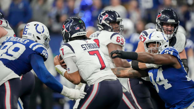 Indianapolis Colts defensive tackle DeForest Buckner (99) and Indianapolis Colts defensive end Tyquan Lewis (94) move in to sack Houston Texans quarterback C.J. Stroud (7) on Saturday, Jan. 6, 2024, during a game against the Houston Texans at Lucas Oil Stadium in Indianapolis.  