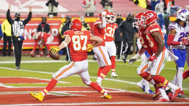 Chiefs tight end Travis Kelce (87) celebrates after scoring a touchdown against the Buffalo Bills during the third quarter in the AFC Championship Game at Arrowhead Stadium.