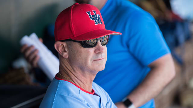 Mississippi Rebels head coach Mike Bianco looks on from the dugout during the game against the Arkansas Razorbacks at Baum-Walker Stadium. Mandatory Credit: Brett Rojo-USA TODAY Sports