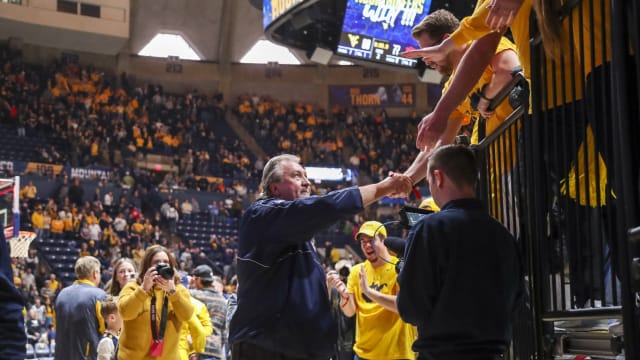 Jan 28, 2023; Morgantown, West Virginia, USA; West Virginia Mountaineers head coach Bob Huggins celebrates with fans after defeating the Auburn Tigers at WVU Coliseum.