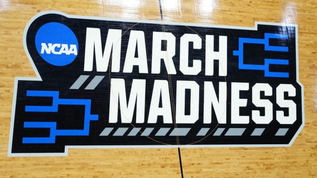 The NCAA March Madness logo is shown on a court during the 2022 tournament.