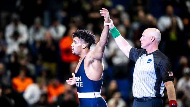 Penn State wrestler Carter Starocci celebrates becoming a three-time national champ at the 2023 NCAA Wrestling Championships.