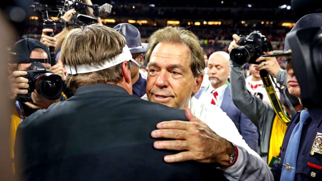 Jan 10, 2022; Indianapolis, IN, USA; Alabama Crimson Tide head coach Nick Saban and Georgia Bulldogs head coach Kirby Smart shake hands after the 2022 CFP college football national championship game at Lucas Oil Stadium.