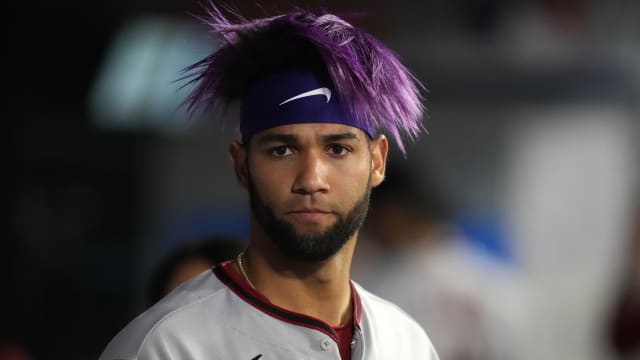 Diamondbacks outfielder Lourdes Gurriel Jr. (12) watches the game against the Angels from his own dugout.