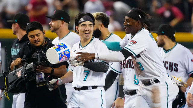 Diamondbacks outfielder Corbin Carroll (7) celebrates a walk-off win with Geraldo Perdomo (2) after his RBI single in the 10th defeated the Pittsburgh Pirates 3-2 at Chase Field.