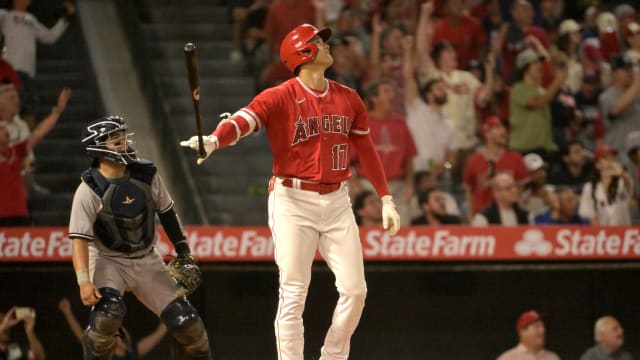 Los Angeles Angels designated hitter Shohei Ohtani flips his bat after hitting a two-run home run in the seventh inning Monday against New York Yankees at Angel Stadium. Ohtani is rumored to be a trade target of multiple teams, including the Texas Rangers.