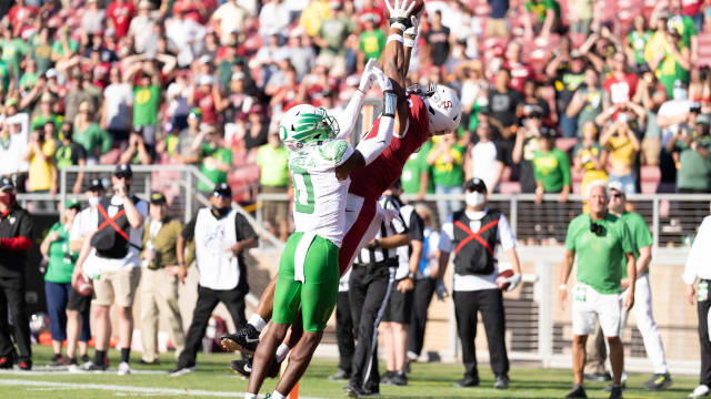 Stanford Cardinal wide receiver Elijah Higgins (6) catches the ball for a touchdown during the fourth quarter against Oregon Ducks cornerback DJ James (0) at Stanford Stadium.