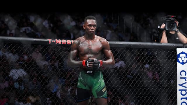 Israel Adesanya inside the Octagon defending the UFC Middleweight Championship.