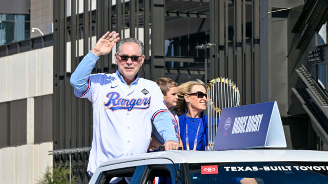 Texas Rangers manager Bruce Bochy and the Commissioner's Trophy during the World Series championship parade on Nov. 3 at Globe Life Field.