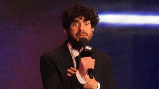 Tony Khan passionately speaks to the crowd during an AEW Dynamite taping.