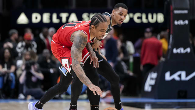 Chicago Bulls forward DeMar DeRozan (11) and Atlanta Hawks guard Dejounte Murray (5) battle for control of the ball during the second half at State Farm Arena. 