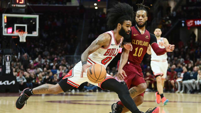 Chicago Bulls guard Coby White (0) drives to the basket against Cleveland Cavaliers guard Darius Garland (10) during the second half at Rocket Mortgage FieldHouse.