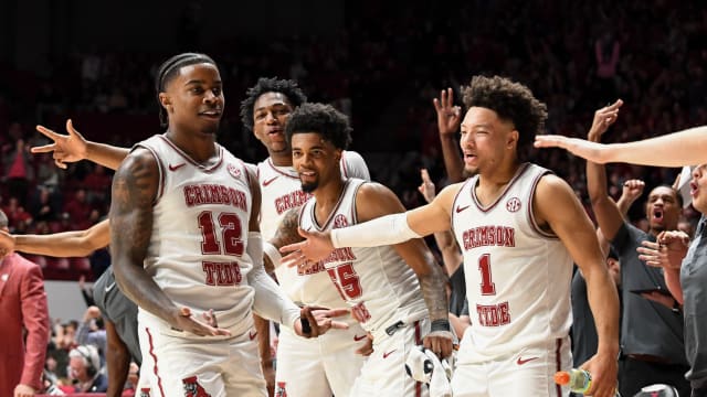 Feb 17, 2024; Tuscaloosa, Alabama, USA; Alabama Crimson Tide guard Latrell Wrightsell Jr. (12) celebrates with the Alabama bench after making a three point basket against the Texas A&M Aggies during the second half at Coleman Coliseum. Alabama won 100-75. Mandatory Credit: Gary Cosby Jr.-USA TODAY Sports  