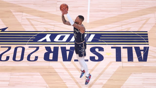 Damian Lillard of the Milwaukee Bucks attempts a three from half court during the 2024 NBA All-Star Game.